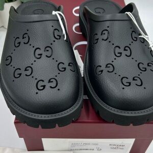 Men's Gucci Black rubber slip on sandals . Cut out monogram .